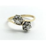 An 18ct yellow gold and diamond multi cluster ring