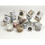 A collection of mugs and cups including commemorat