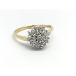 An 18ct yellow gold diamond cluster ring, approx 0