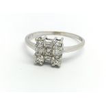 An 18ct white gold and diamond cluster ring, size
