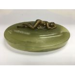 A onyx pen tray of oval shape with reclining nude