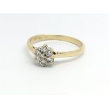 An 18ct yellow gold and seven stone diamond cluste