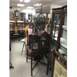 A 20th century mahogany bird Cage in the form of a