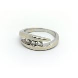 A white gold and three diamond ring, approx 0.30ct