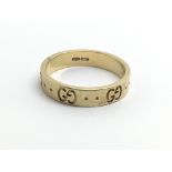 A Gucci 18ct yellow gold band, approx ring size M