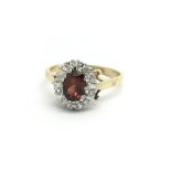 An 18ct yellow gold diamond and red stone, possibl