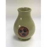 A small Moorcroft vase with stylistic roundel desi
