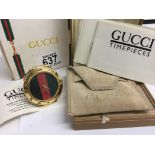 A Gucci Gold plated 0300 Bellissimo travel clock w