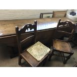 A large drop leaf table with a set of six matching