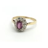 An 18ct yellow gold diamond and pink sapphire clus