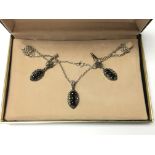 A silver and marcasite necklace and earrings set