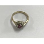 A 9 ct ring inset with a ruby size N total weight