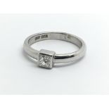 An 18ct white gold ring set with single princess c