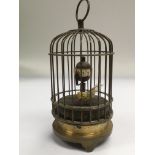 An antique metal cased bird automaton within a pie