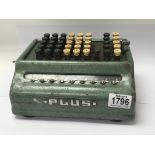 An old Plus long division mechanical calculator.