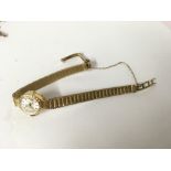 A 9ct gold ladies wrist watch. 15.1g.