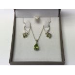 A silver and peridot necklace and earrings set