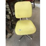 A 1970s painted steel swivel desk chair.