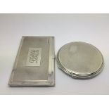 A silver compact and a silver card case (2).