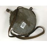 An old horn powder flask with leather strap handle