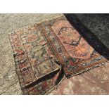 Two antique hand knotted rugs with geometric patte