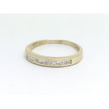 A 9ct yellow gold and diamond half eternity ring,