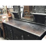 A 19th century carved Flemish oak sideboard with a