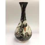 A Moorcroft vase of baluster form depicting swans,