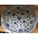 A large Chinese style blue and white charger and 3