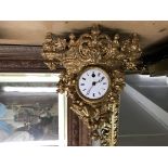 A small French ornate gilt clock.