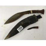 A possibly Military Kukri with wooden handle and small sharpener in original sheath