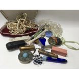 A collection of costume jewellery and vintage make