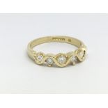 An 18ct yellow gold and diamond ring the band havi