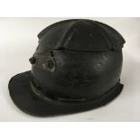 A metal and leather miners helmet