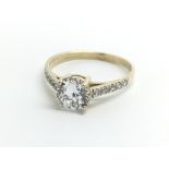 A 9ct yellow gold and moissanite solitaire, ring s