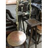 A gilt cheval mirror open book case plant stand and a circular table with copper top .