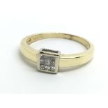 An 18ct yellow gold ring set with nine princess cu