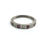 An 18ct white gold half eternity ring set with alt