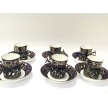 A set of six porcelain cups and saucers with silve
