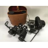 A Canon camera and two pairs of binoculars (3).