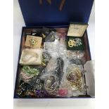 A box of various costume jewellery.