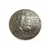 A WW1 memorial plaque 'death penny' commemorating