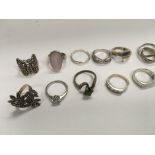 A collection of 15 sterling silver rings.