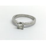 An 18ct white gold ring set with a princess cut di