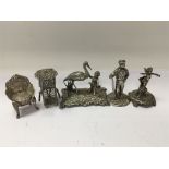 A collection of silver castings comprising figures