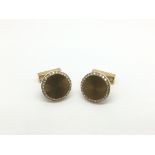 A pair of 18ct gold and diamond set cufflinks, app