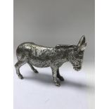 A silver solid cast donkey London hallmarks, 1, 19