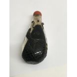 A Chinese glass snuff bottle with coral top , 8 cm
