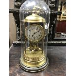 A large French brass Anniversary clock under dome,