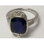 An 18ct white gold cushion sapphire and diamond Ar